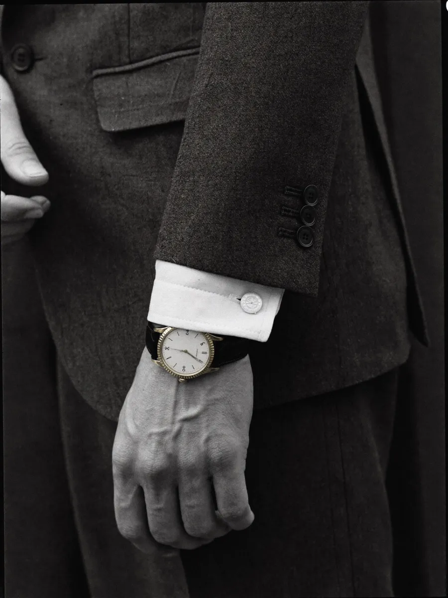 A shirt cuff and a wristwatch