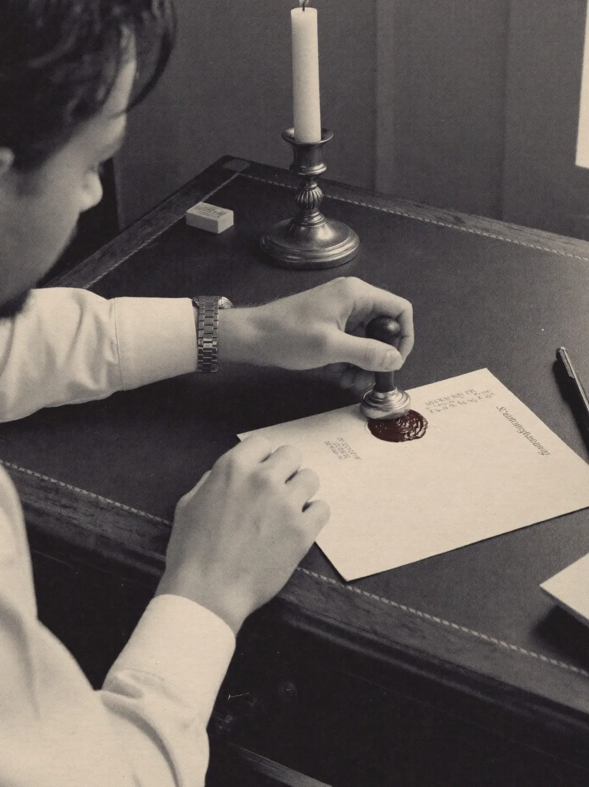 A letter being sealed with wax